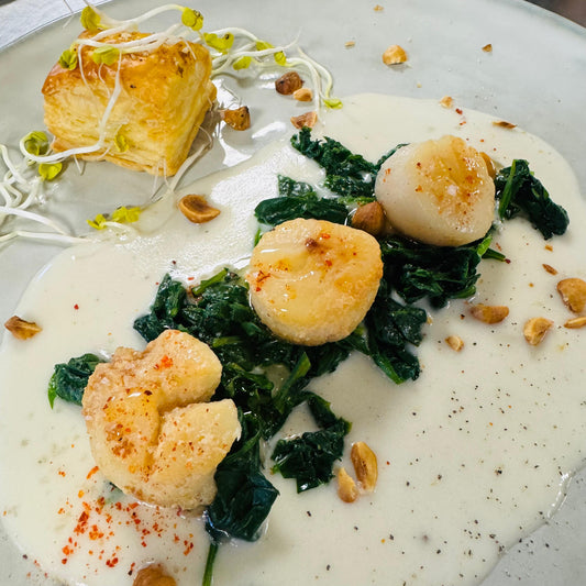 Christmas: Starter: Scallops, creamy baby spinach and hazelnut pieces